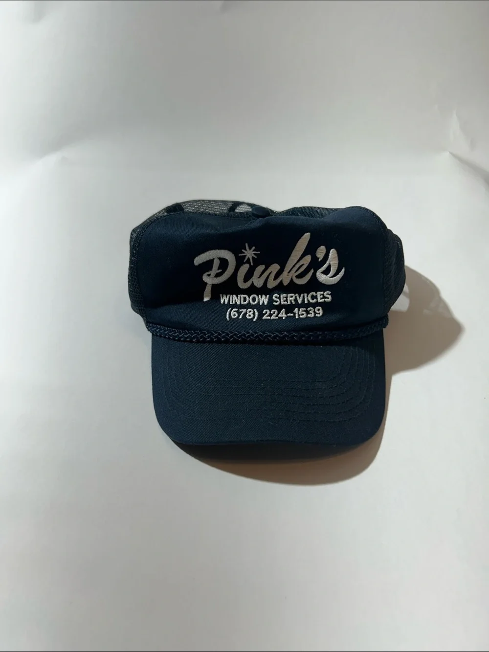 Port Authority Navy Blue Trucker Cap with White Logo